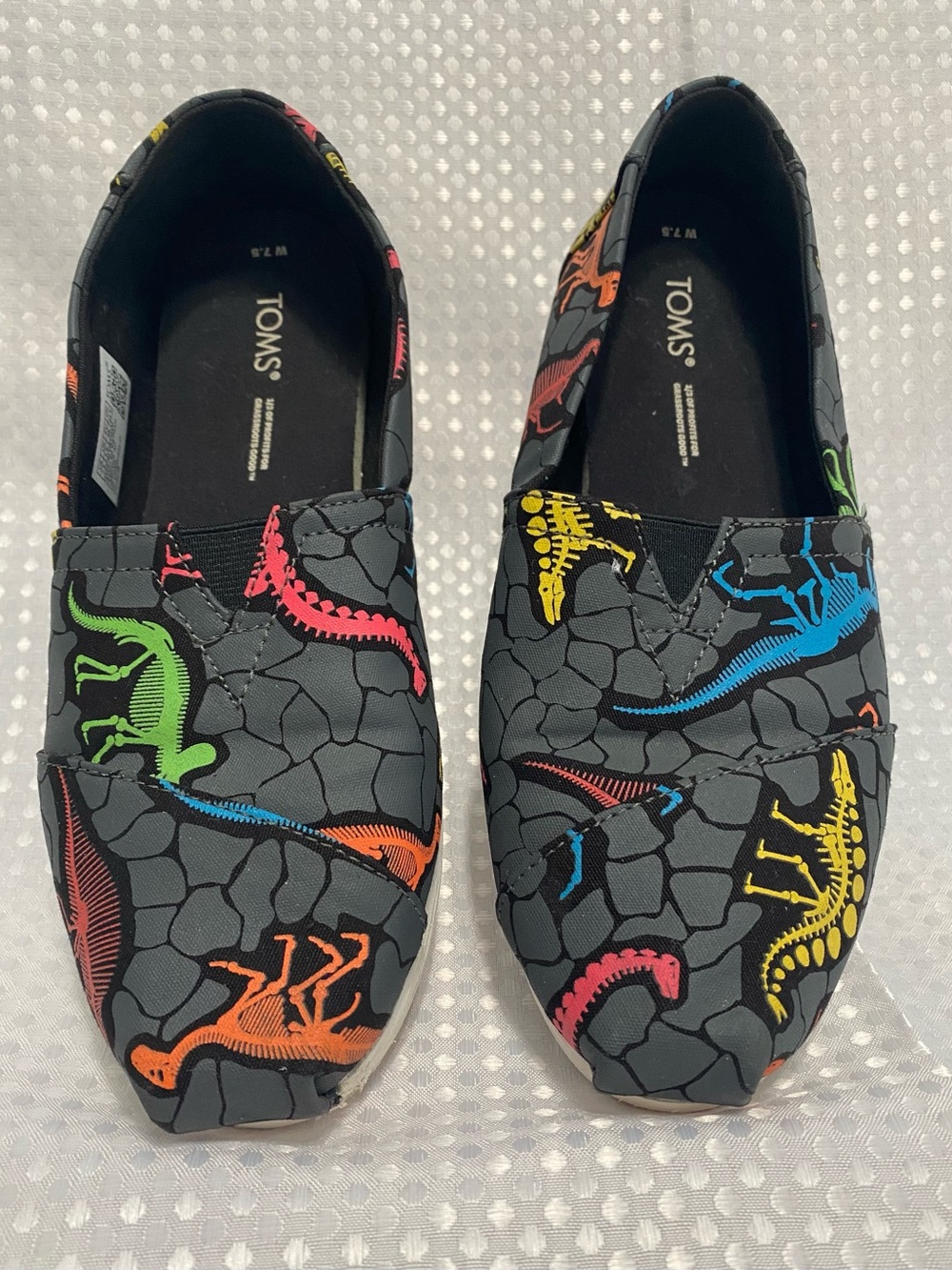 Toms Black Slip-On Sneakers with Multicolor Dinosaur Skeletons